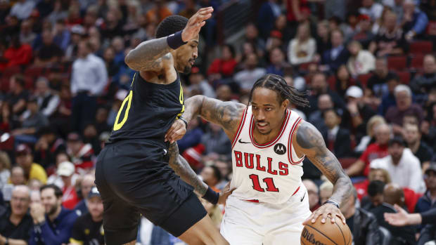Chicago Bulls forward DeMar DeRozan (11) drives to the basket against Utah Jazz forward John Collins (20) 
